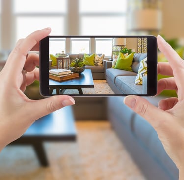 a person taking a picture of a living room