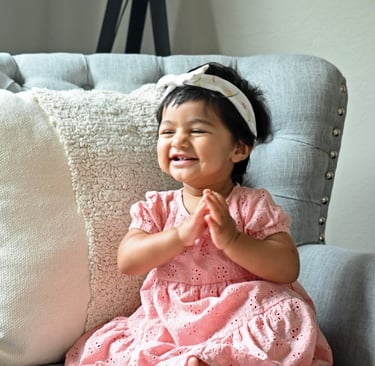 Baby girl posing for the camera on her 1st birthday.