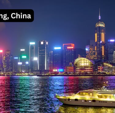 A breathtaking night view of the Hong Kong skyline across Victoria Harbour. The skyscrapers of Centr