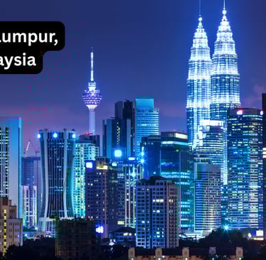 A stunning night view of the illuminated Kuala Lumpur skyline in Malaysia. The twin Petronas Towers 