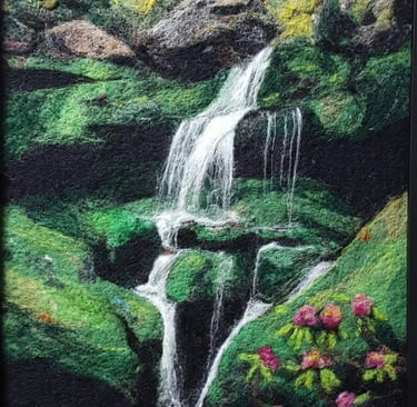 a wool felt fiber art painting of a waterfall in a forest