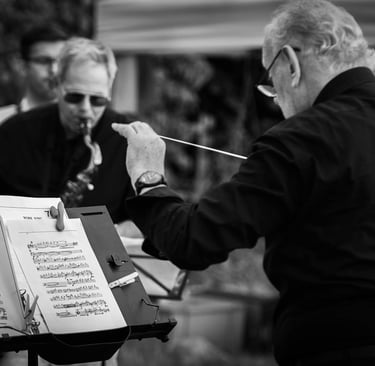  A black and white portrait of a conductor during the concert in the open air in Duxford. Author: Slawek Dejneka