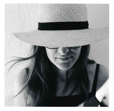 An analogue picture of a woman wearing a hat. Creator: Slawek Dejneka