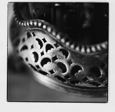 A picture of a silver salt and pepper holder. Creator: Slawek Dejneka