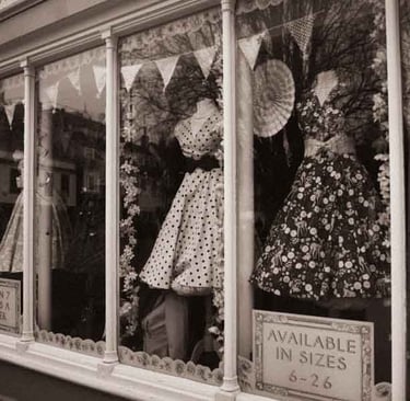 A picture of a storefront with mannequins in Cambridge, UK, Creator: Slawek Dejneka