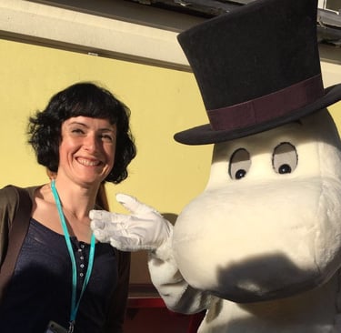 I am stood smiling next to a human-sized Moomin