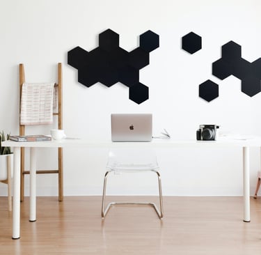 a desk with a laptop and a laptop on a table