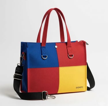 Tas tote SIGNIFO dengan desain color-block empat kuadran berwarna merah, kuning, dan biru.
