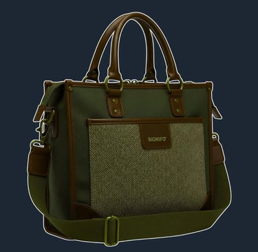 A sturdy, structured tote with a rectangular form, reinforced with dark brown leather corners and trim.