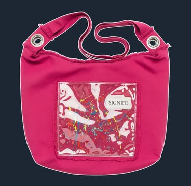 A large, oversized, and completely unstructured 'slouch' bag, made from a single large piece of canvas, with raw, frayed edge
