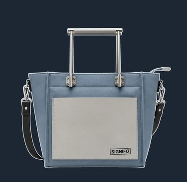 A highly architectural tote with a rigid, folded construction, featuring exposed gussets and a clean, sharp silhouette.