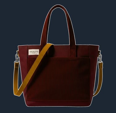 A simple, yet structured north-south tote with a clean, open-top design. The hard-finish canvas gives it a defined shape.