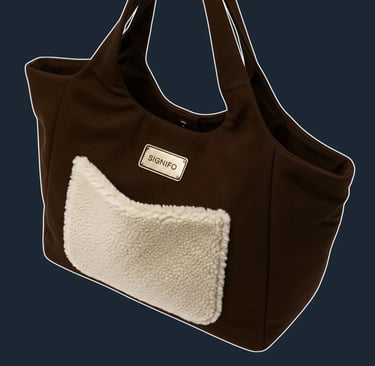 A large, soft, and slouchy 'shopper' tote that is unstructured and comfortable to carry.
