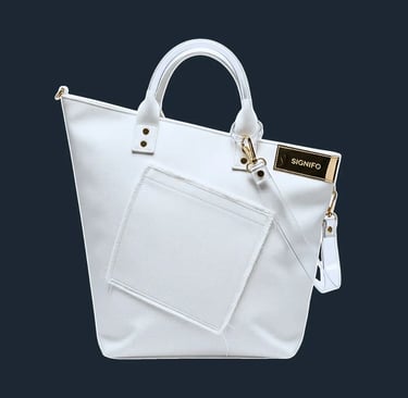 An asymmetrical tote bag, where one side is taller than the other, creating an uneven, slanted top opening.