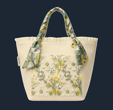 A charming, medium-sized tote with a slightly flared 'A-line' silhouette and a ruffled or pleated top edge.