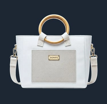 A minimalist, rectangular tote with a soft, yet stable structure and clean, folded corners.