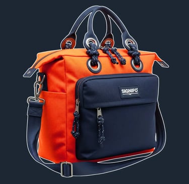 A sturdy, functional 'navigator' tote with a boxy shape, zip-top closure, and multiple exterior compartments.