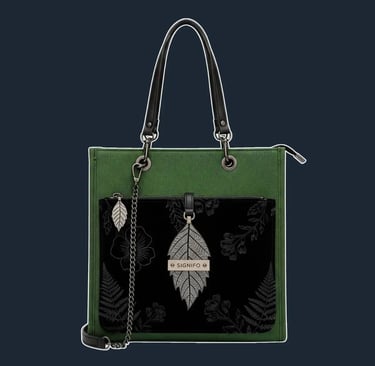 An elegant, structured tote with a clean, vertical silhouette and a secure zip-top, perfect for an evening out.