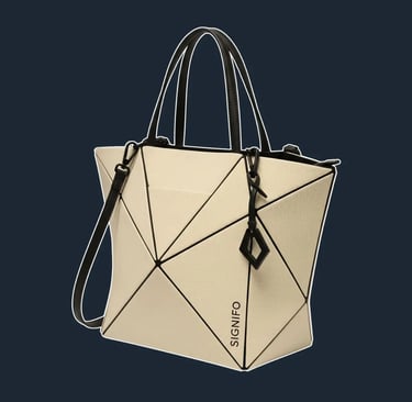 A highly structured tote with a unique, geometric folded construction that creates sharp, origami-like pleats and angles