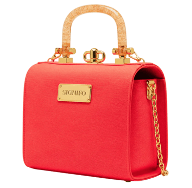 A rigid, boxy, 'lunchbox' style tote with a curved top and a structured, self-supporting form.