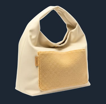 A large, oversized, and completely unstructured 'slouch' or 'hobo' bag that drapes beautifully and forms natural, soft folds