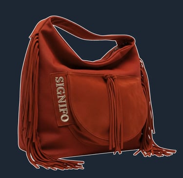 A large, soft, and unstructured 'hobo' or 'slouch' bag that drapes beautifully from the shoulder.