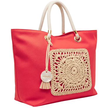 A soft, unstructured, and spacious 'boat' tote with a wide, open top, perfect for a beach day.
