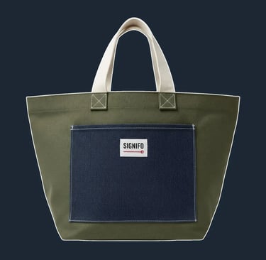A very simple, almost rustic, open-top tote with a wide, stable base and clean, folded construction.