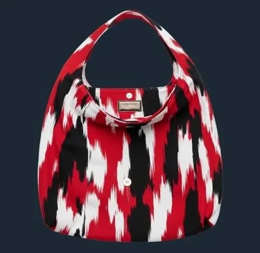 Hobo bag SIGNIFO dengan motif abstrak dari kanvas berwarna merah, putih, dan hitam.