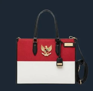 Tote bag SIGNIFO edisi spesial merah putih dengan emblem Garuda dan aksen hitam elegan.