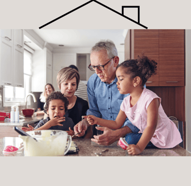 Elders and children cooking together with parents watching