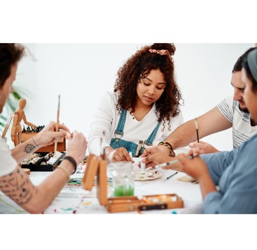 Group of young adult artists working together