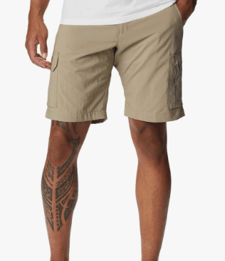 a man with tattoos on his leg and a tattoo on his leg