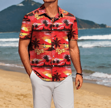 a man in a hawaiian shirt and sunglasses on a beach