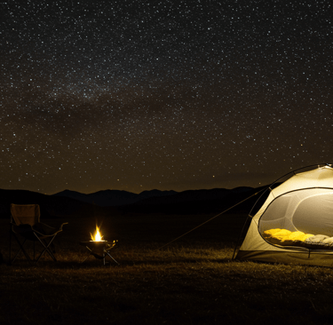 Tent and sleeping bag for camping under the stars and by a fire