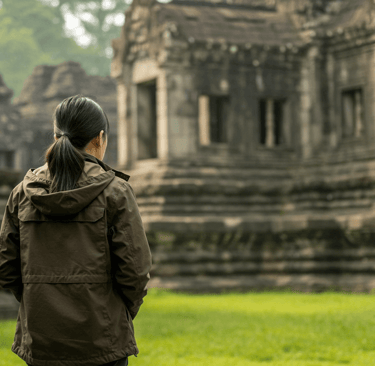 Woman traveler smiling in light rain wearing a versatile 3-in-1 travel jacket