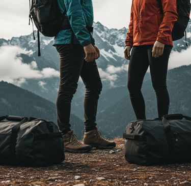 Large black duffle bag with multiple compartments, ideal for outdoor adventures