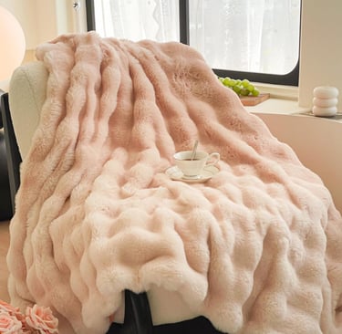 a pink blanketed Luxury blanket on a chair