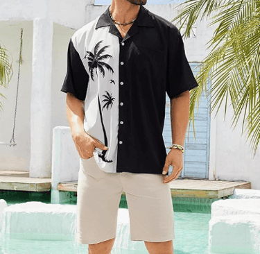 a man in a black shirt and shorts standing in front of a pool