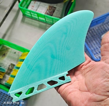 a person holding a piece of plastic material