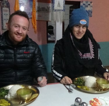 two trekkers at a meal in Nepal