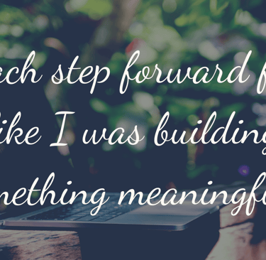 a laptop in a garden with a quote about building something meaningful