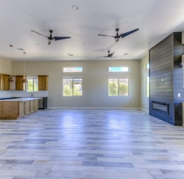 a large open kitchen with a ceiling fan and a ceiling fan