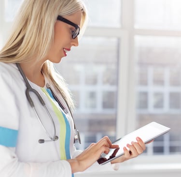 A doctor utilizes ClinicalHawk's EDC system to review and analyze clinical patient data efficiently and effectively.