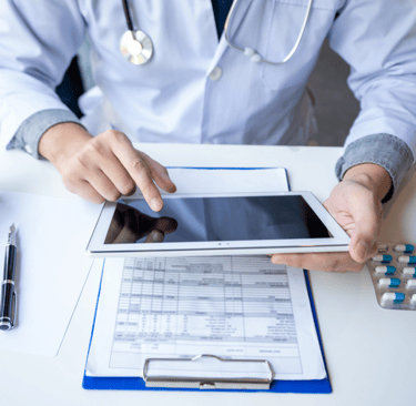 Doctor reviewing clinical subject documents through the ClinicalHawk eTMF & RM system.