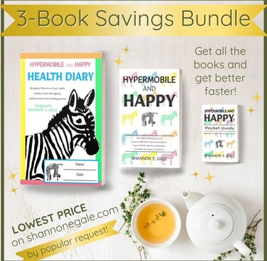 health diary, book, and pocket guide on a table with thyme herb branches, a teapot, and a cup of tea