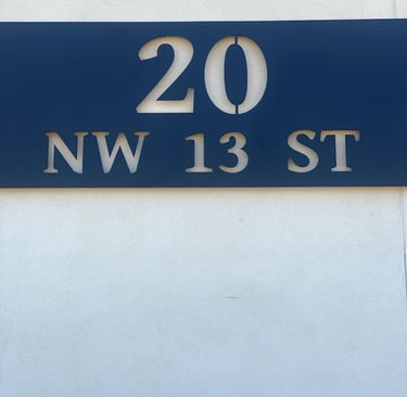 20 NW 13th St sign on exterior of our office