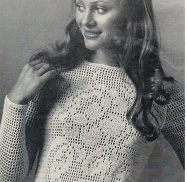 a woman in a white crochet shirt