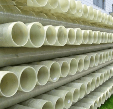 a pile of pipes and pipes in a yard