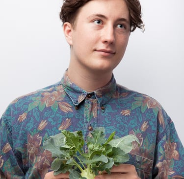 Musician Elliot photographed with a turnip.